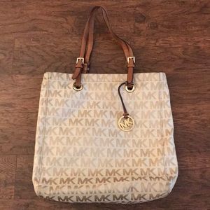 Michael Kors tan purse.
